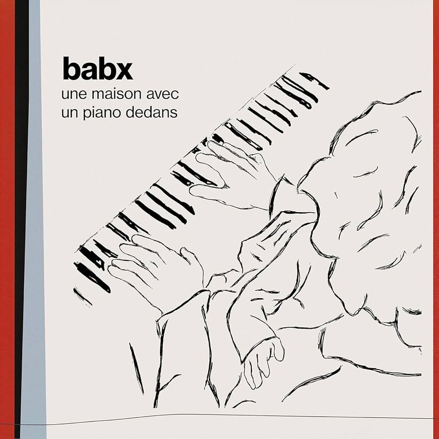 Babx – Un piano avec une maison dedans
